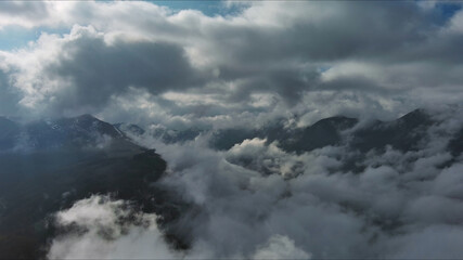 Fototapeta premium Aerial high view of dramatic clouds and sun