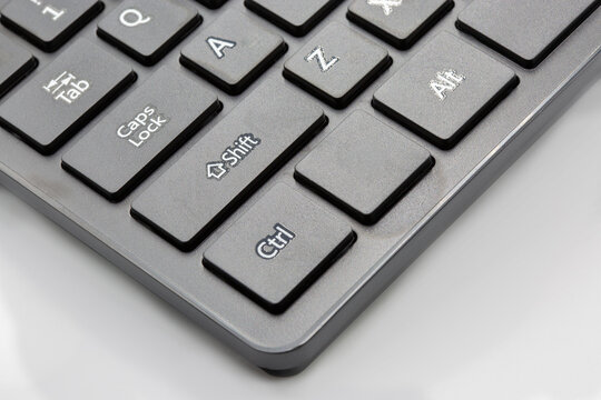 Computer keyboard with Shift, Ctrl, Alt keys on white background.