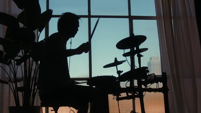 Electronic drum midi kit, Stage, performance and man on drums concert playing jazz, beat music. Man Drummer, musician and creative person percussion, instrument or show at night