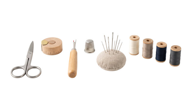 Clothing repair and sewing essentials including scissors, thread, needles, measuring tape and seam ripper. Isolated on White background