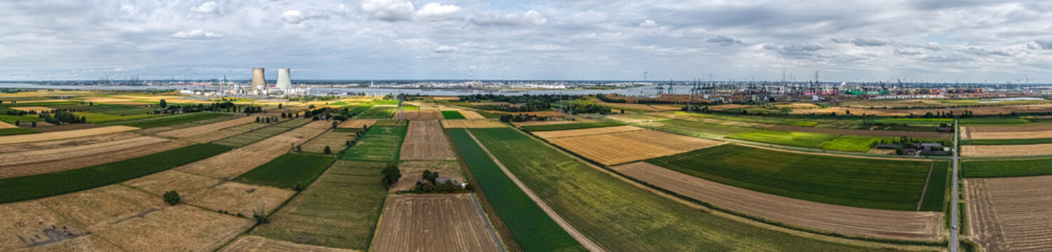 Aerial view of the Doel Nuclear Power Plant near the Scheldt river, surrounded by agricultural fields and patchwork farmland in Beveren-Kruibeke-Zwijndrecht, Vlaanderen, Belgium.