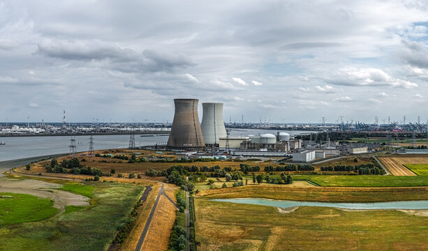 Aerial view of Doel Nuclear Power Plant with cooling towers, situated along the Scheldt river near agricultural fields in Beveren-Kruibeke-Zwijndrecht, Vlaanderen, Belgium.
