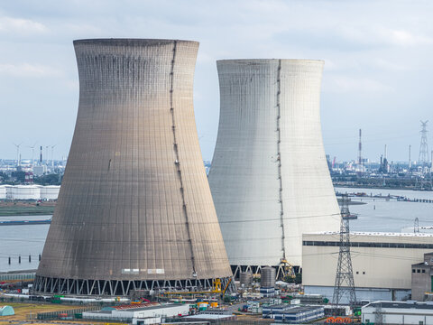 Aerial view of ENGIE Electrabel - Nuclear Power Plant Doel with its iconic cooling towers situated along the Scheldt river in Beveren-Kruibeke-Zwijndrecht, Vlaanderen, Belgium.