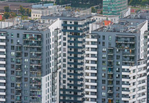 Aerial view of modern residential apartment buildings with balconies and flat roofs in the urban landscape of Gdansk, Pomeranian Voivodeship, Poland.