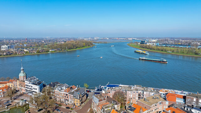 Aerial view of commercial shipping traffic at the river Drierivieren confluence Dordrecht Netherlands