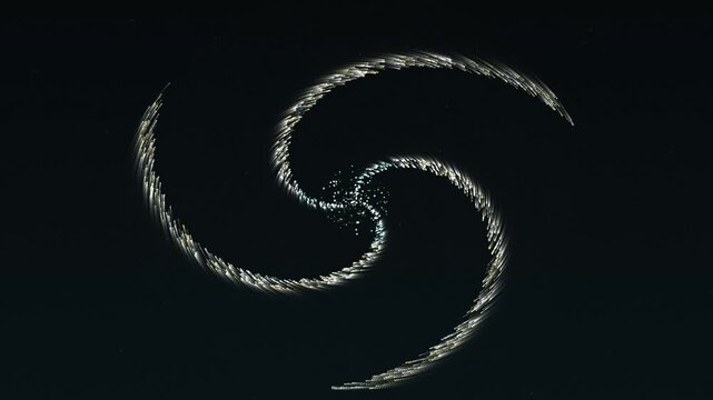 Abstract spiral light trails forming a triple swirl pattern