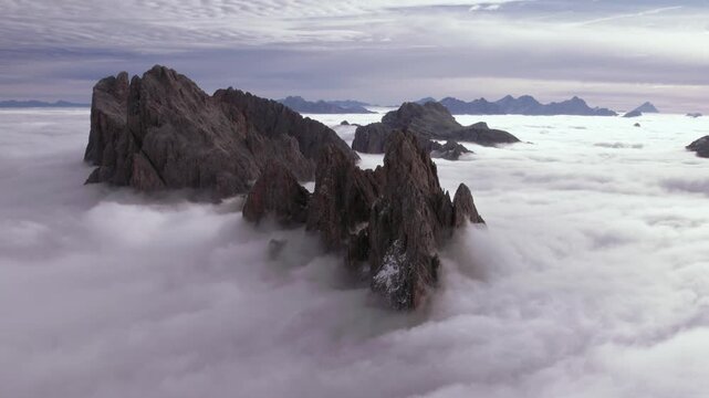 Flying over a cloud inversion at Seceda in the Italian Dolomites