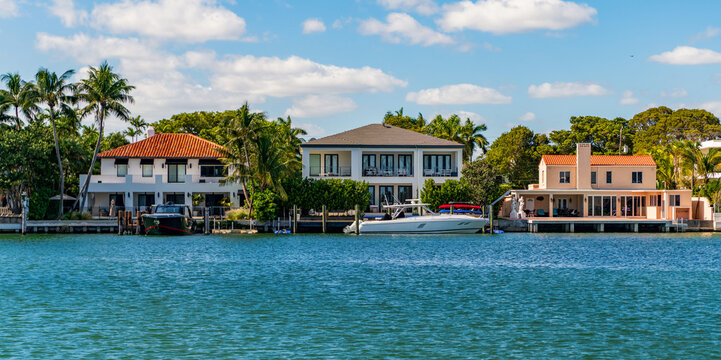 Vacation on summer. Docked yacht at private area. Sea vacation on summer. Private dock. Residential hotel. Luxury yacht at private house. Modern building. Residential apartment in waterfront city