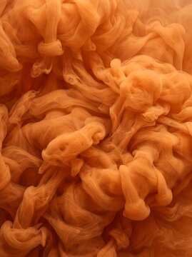 Abstract orange ink swirls create a dynamic potrait background with fluid organic textures for web design, digital art projects, and social media templates.
