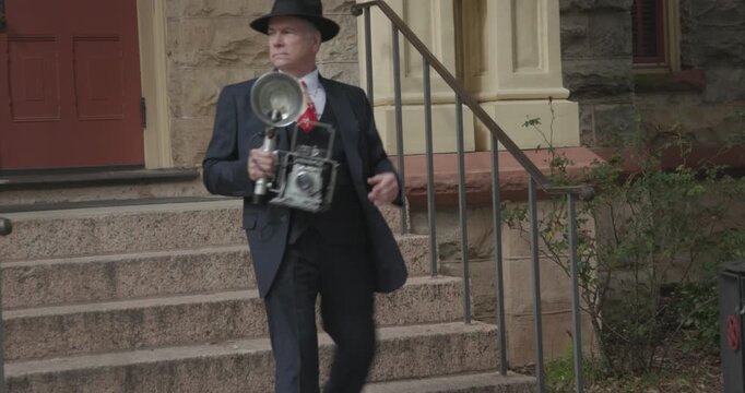 Vintage 1940s reporter waiting outside the courthouse