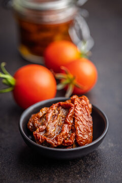 Sun-Dried Tomatoes in Bowl with Fresh Cherry Tomatoes and Olive Oil - Gourmet Mediterranean Ingredient