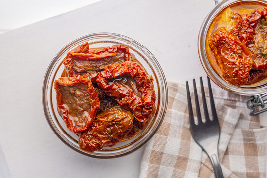 Sun-Dried Tomatoes in Glass Jar Preserved in Olive Oil for Gourmet Mediterranean Cooking