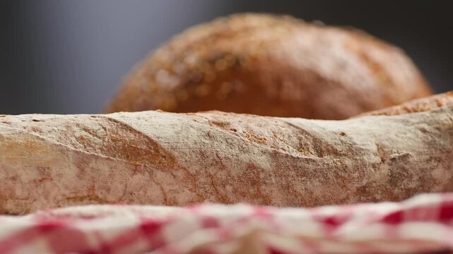 Bread assortment, mixed Spanish baguette loaves from Barcelona bakery, close-up macro shot showing crumb texture