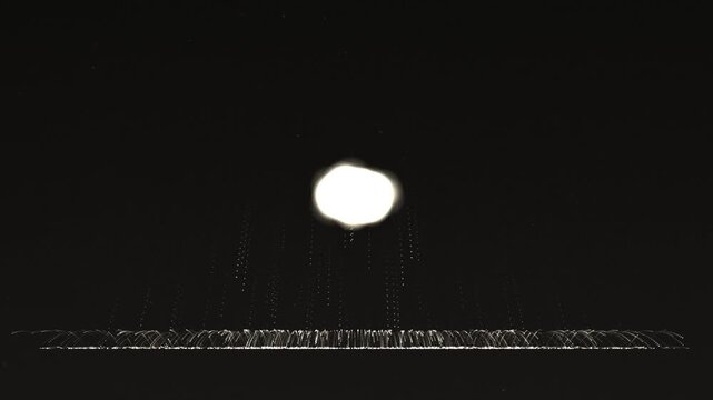 Bright glowing moon shining in the dark night sky