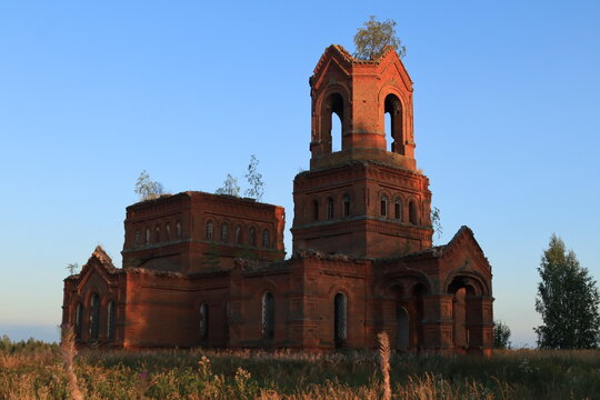 The old abandoned Orthodox Church of St. Michael the Archangel in the abandoned village of Mikhailovka in the north of the Kirov region on a summer day