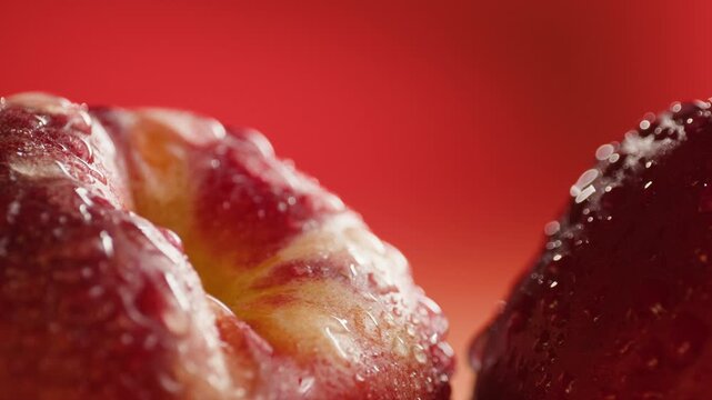 Nectarine or peach fruit, fresh Spanish red nectarine, peaches stacked on wooden table with red background