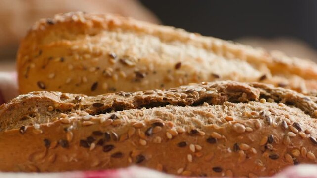 Baguette Bread torn apart by hand, fresh baguette crumb close-up macro shot showing soft airy texture