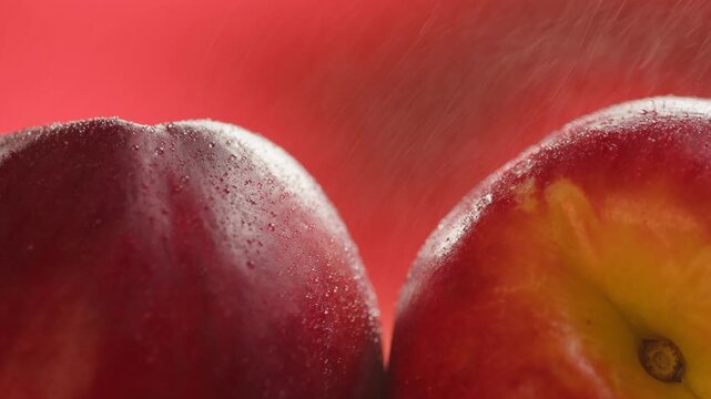 Nectarine or peach fruit, fresh Spanish red nectarine, peaches stacked on wooden table with red background