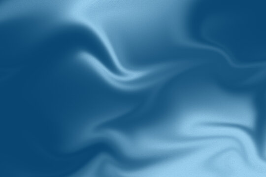 Abstract blue silk fabric background with soft waves and smooth flowing texture.