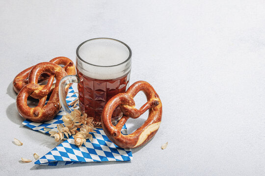 Traditional Oktoberfest set. Pretzels and beer, German festival food concept. Trendy hard light