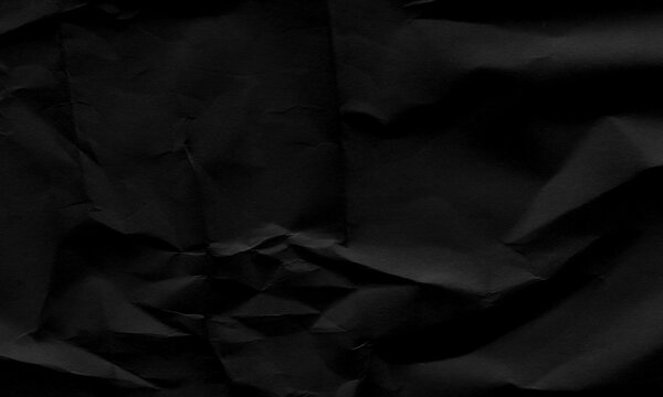 Dark black crumpled paper texture background with creased surface, elegant abstract backdrop Background