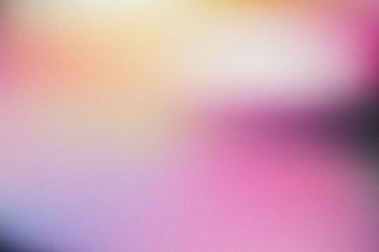 Abstract blurred gradient background with soft pink and purple light texture.