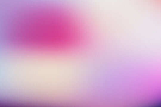 Abstract blurred gradient background with soft pink and purple light texture.