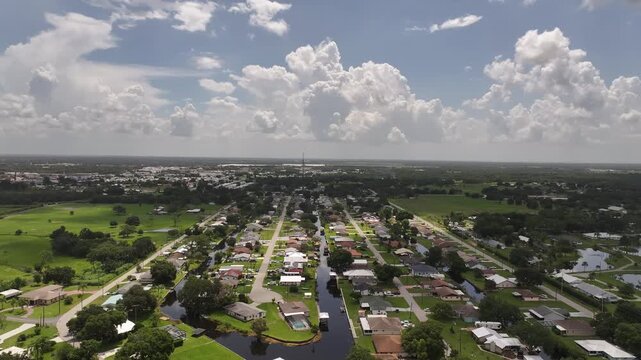 Aerial View of Residential Canal Neighborhood in Sebring, Florida &mdash; Suburban Streets Under Cloudy Sky