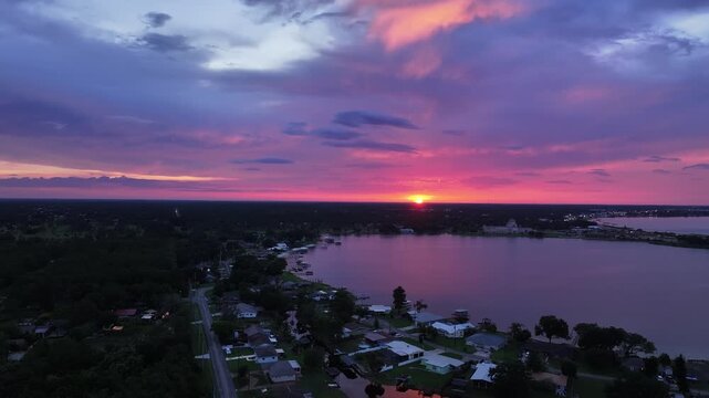  Aerial View of Sun Setting Over Lake Jackson, Sebring, Florida &mdash; Vivid Pink and Purple Sky