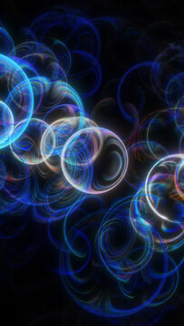 Neon bubbles float and swirl in deep darkness creating bright colorful light effects that resemble liquid motion against a black backdrop at night
