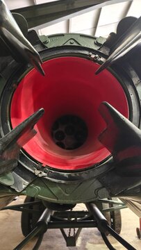 Internal view of V2 rocket combustion chamber with prominent red thrust collar.