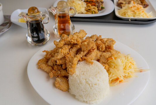 Crispy chicken strips with coleslaw close up