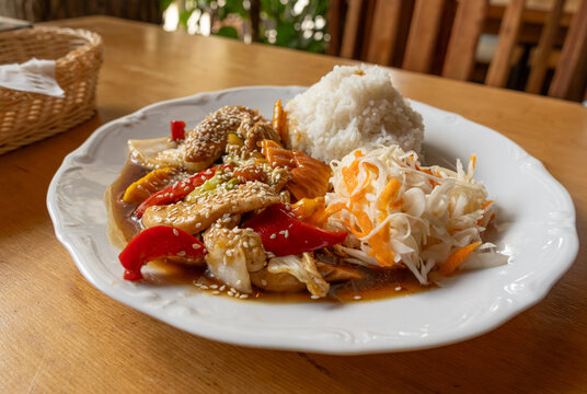 Chicken stir fry with rice and vegetable salad