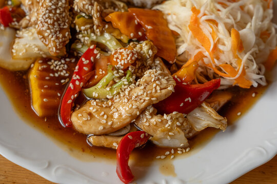 Chicken stir fry with rice and vegetable salad