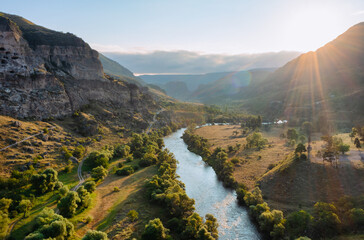 Picturesque canyon with winding river and historic caves in Georgia © Игорь Кляхин