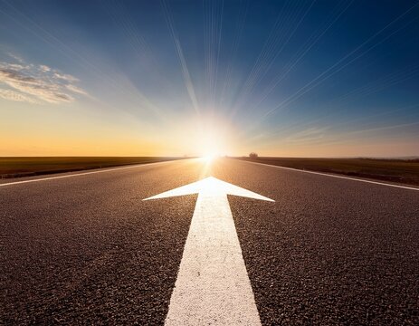 straight highway with white arrow pointing toward bright sun on horizon representing clear vision and future path to success in business journey