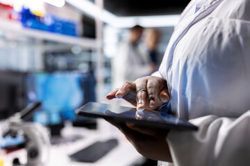 Researcher analyzes molecular biology samples in biotechnology lab