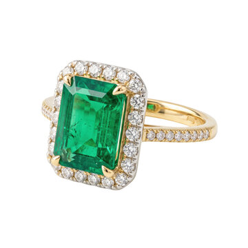 Elegant emerald and diamond halo ring in yellow gold