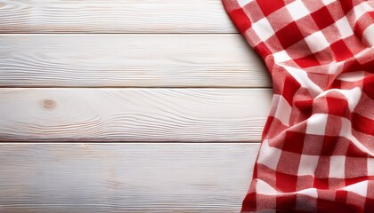 Obraz premium red and white checkered tablecloth on white wooden background