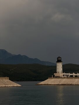 Lighthouse on the Adriatic coast under dramatic storm clouds in Montenegro