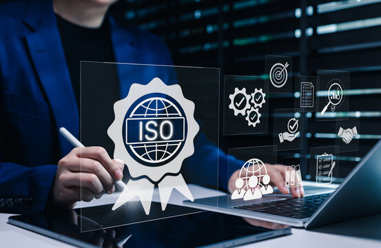 ISO Certification and quality management concept. Businesswoman uses tablet and laptop with ISO certification icons, international standards, compliance, quality management systems, certificate,