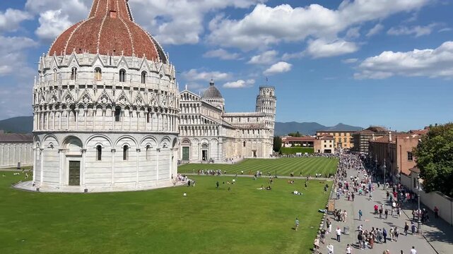 Leaning Tower of Pisa and Cathedral Piazza dei Miracoli,  from the medieval city walls on a sunny day panoramic high angle view.