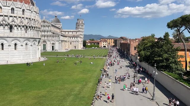 Leaning Tower of Pisa and Cathedral Piazza dei Miracoli, iconic view on a sunny day panoramic high angle view.