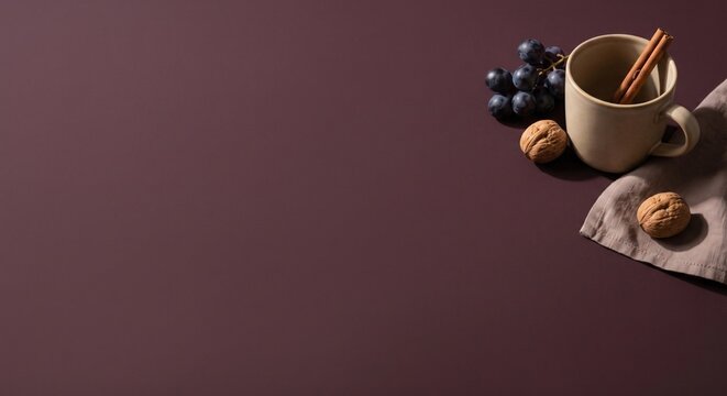 Coffee cup with walnuts and blueberries on dark burgundy background