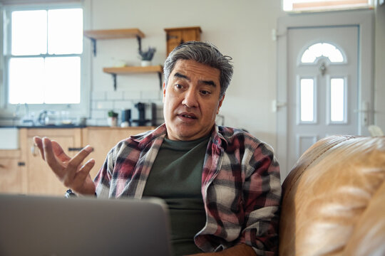 Middle-aged man on video call at home