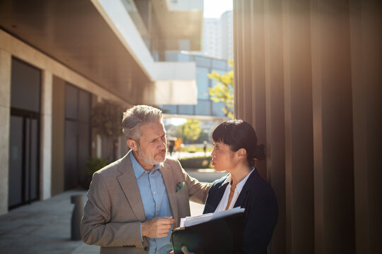 Business colleagues having a serious conversation outside the office