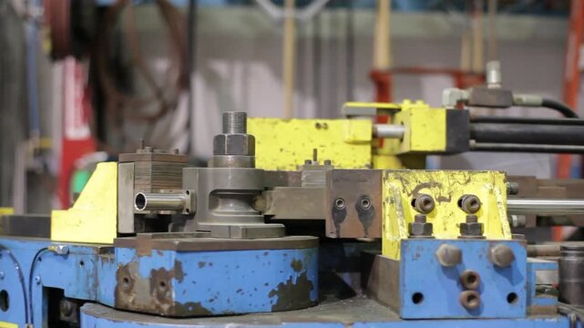 dolly left of an industrial pipe bender