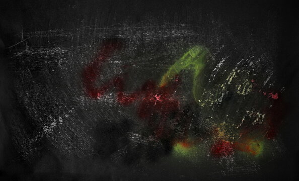 Paint stained and scratched black paper background, colorful scrabble, design element