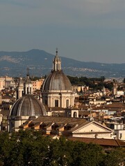 Naklejka premium Historic church domes and cityscape in Rome, Italy