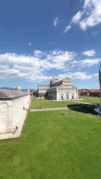 Leaning Tower of Pisa and Cathedral Piazza dei Miracoli,  from the medieval city walls on a sunny day panoramic high angle view.